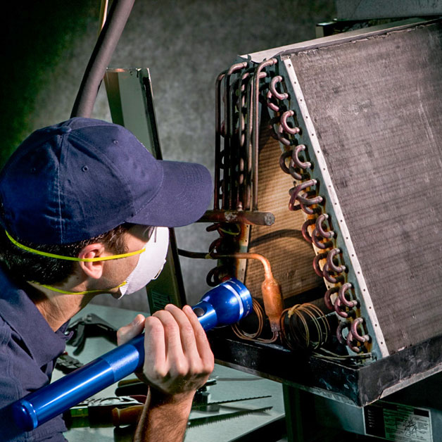 tech looking at coils