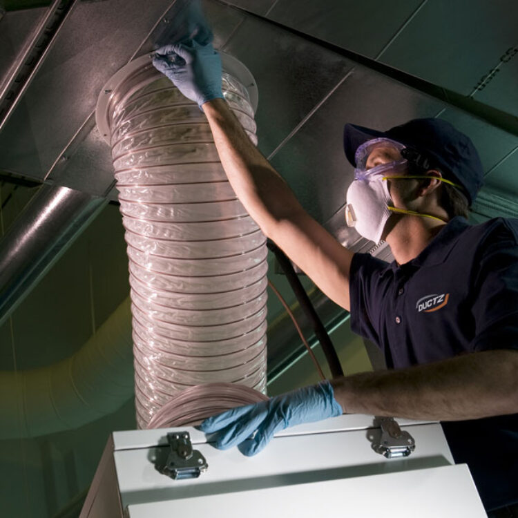 tech looking at vent