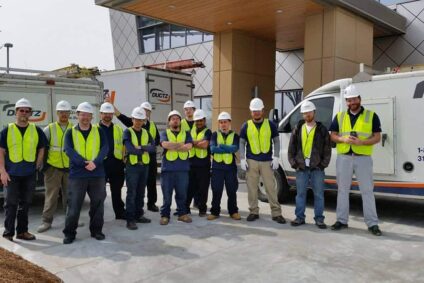 Photo of Ductz commercial duct cleaning workers in front of a work van